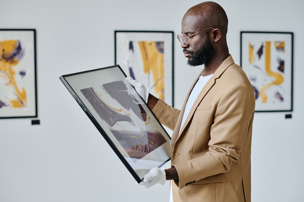 Man looking at artwork